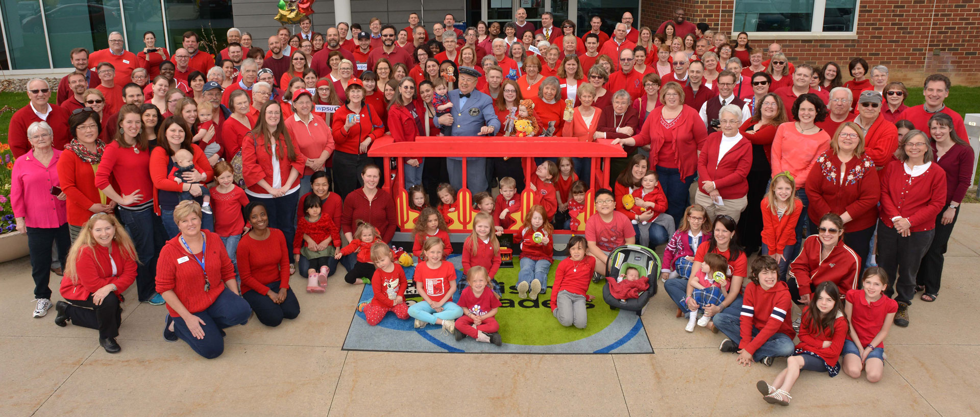 Large group of people dressed in red sweaters to support Red Sweater Day at WPSU