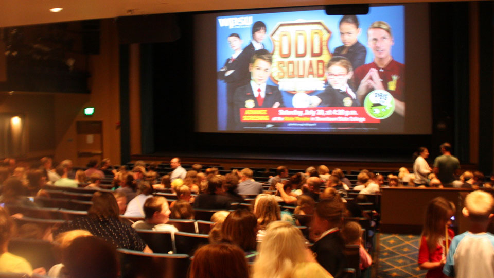 Theater audience getting ready to watch the Odd Squad Movie