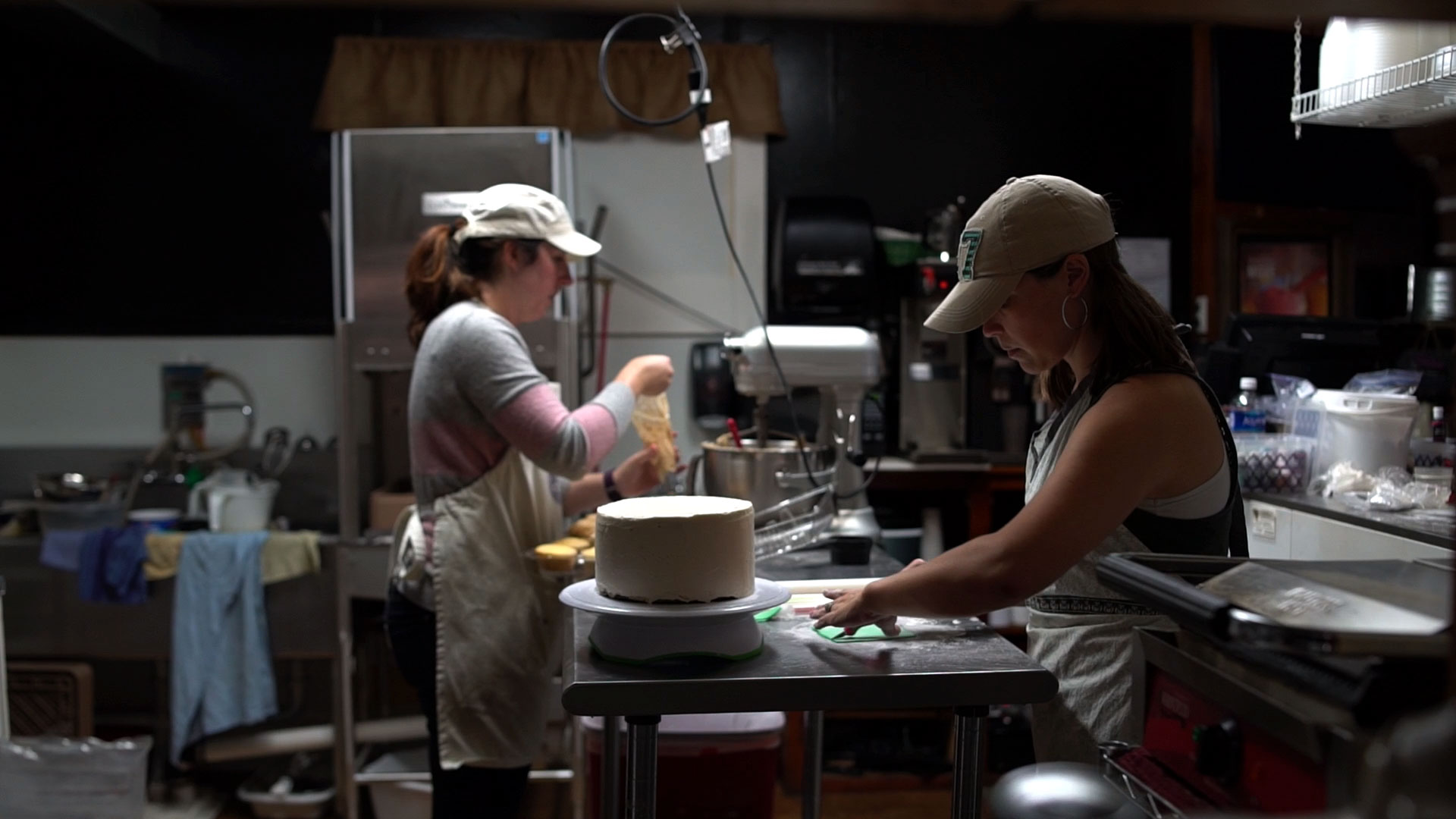 M&C Cakery owners Catie Grant and Melissa Stizer working on a cake