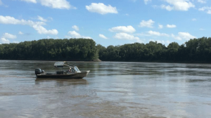 small boat on open water