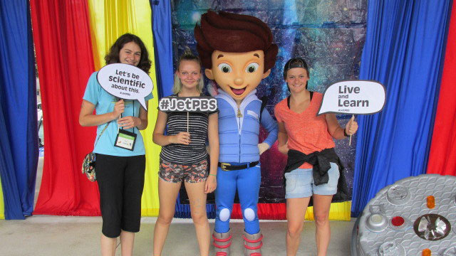 Guests pose for a picture with PBS Kids character Jet Propulsion