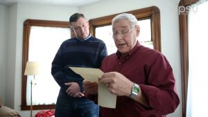 Older man reading letter