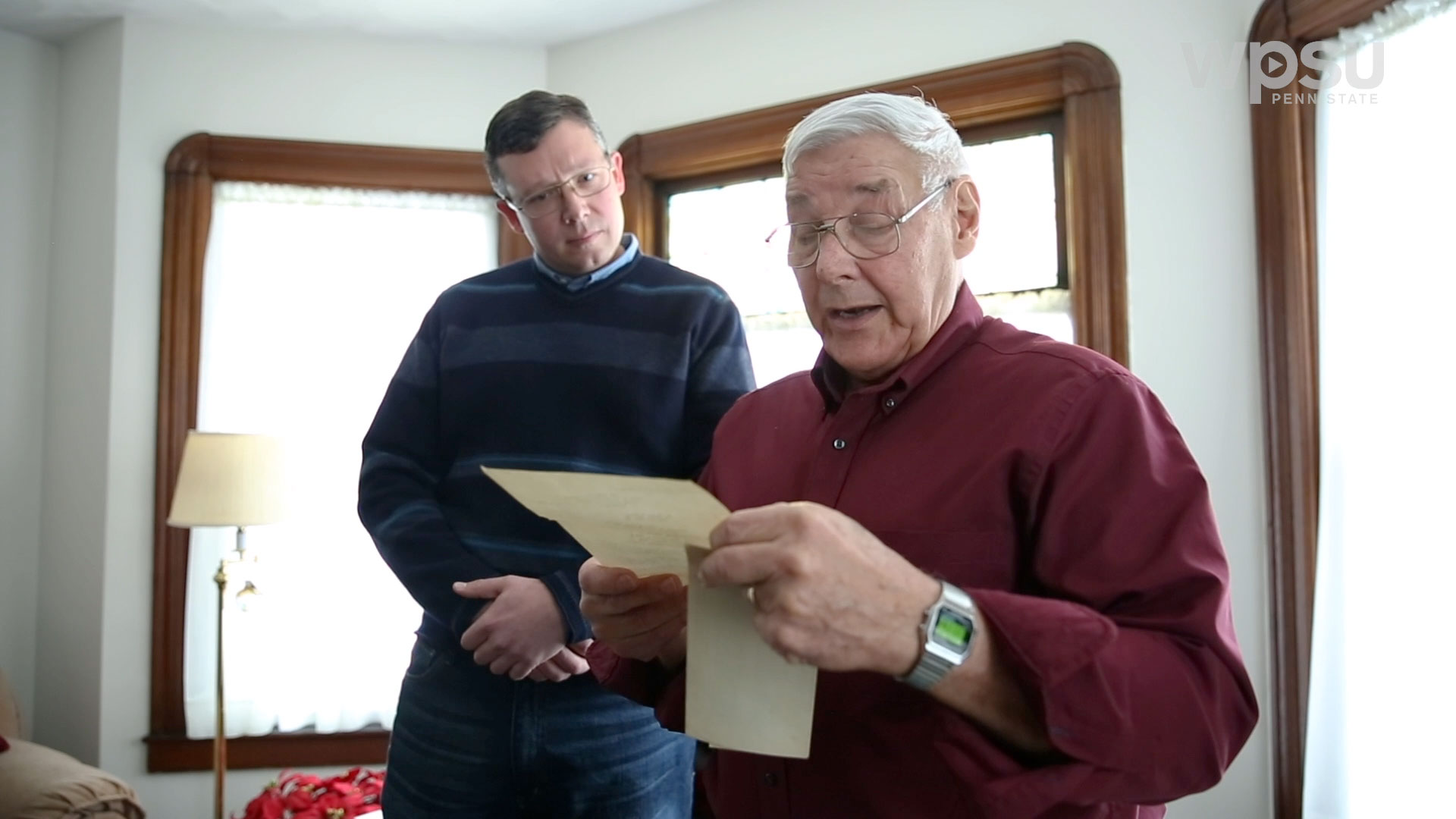 Older man reading letter