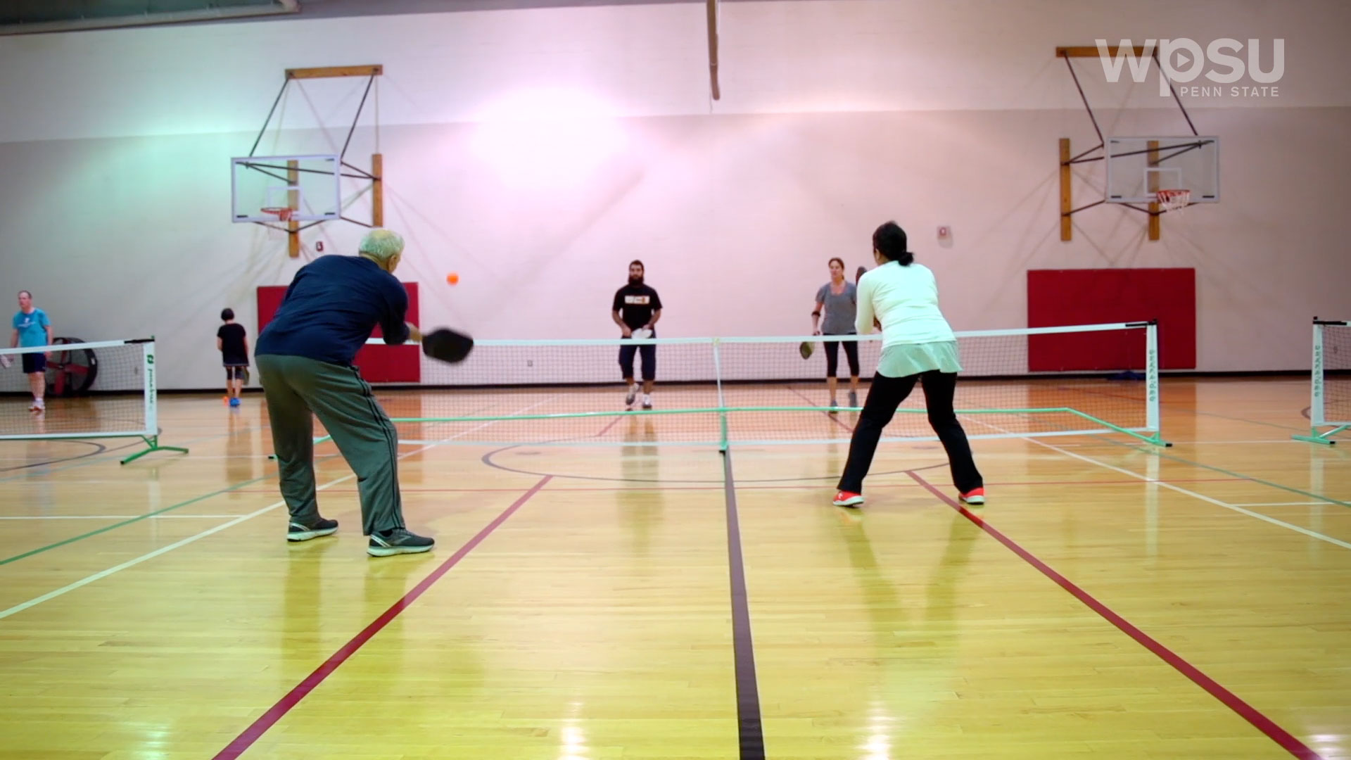People playing pickelball