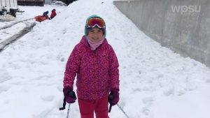 child standing in snow