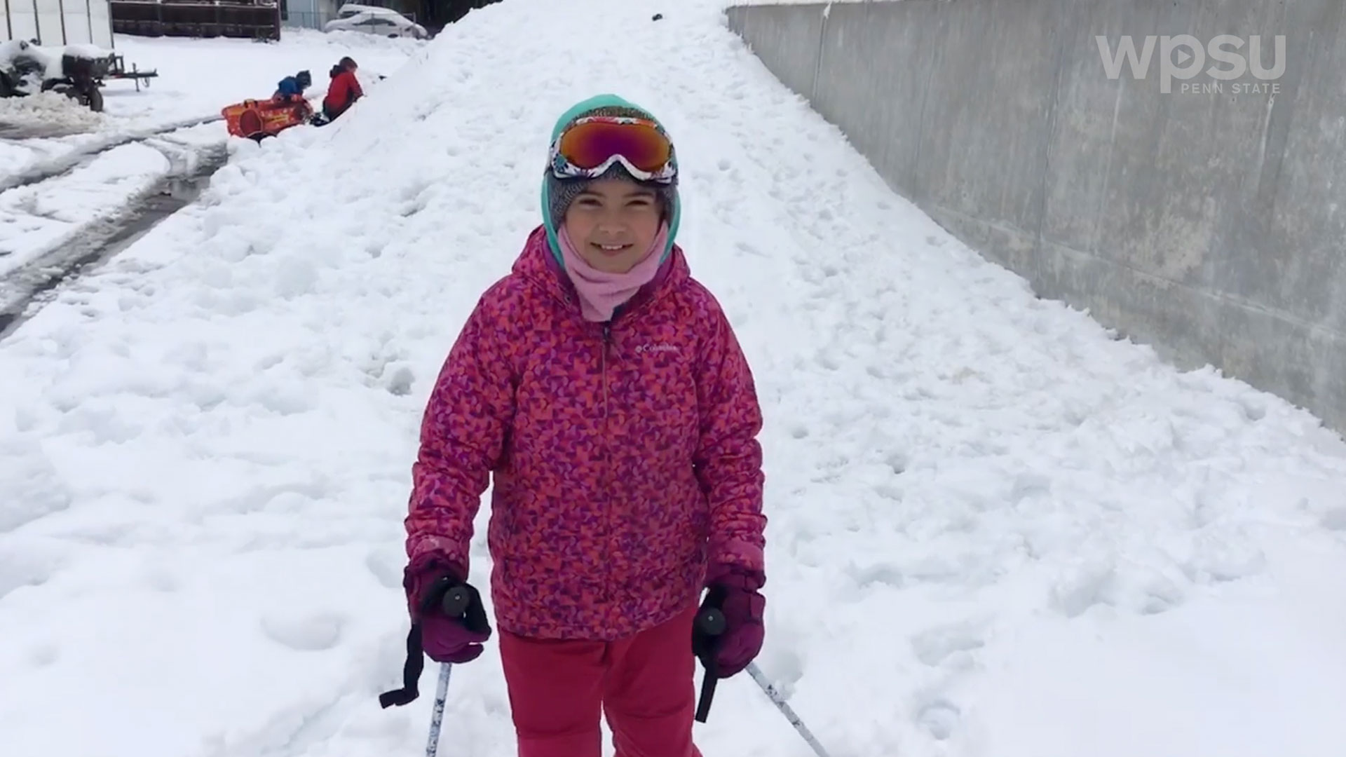 child standing in snow