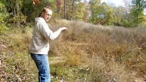 Chad Caldwell tracking deer in woods