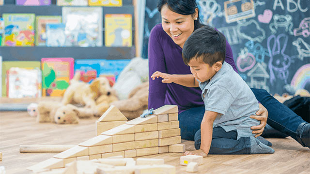 mom and child playing with blocks