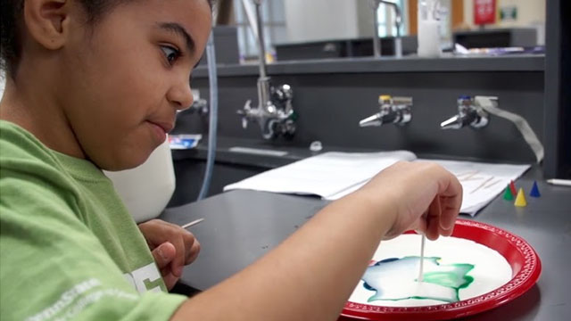 boy experimenting with magic milk