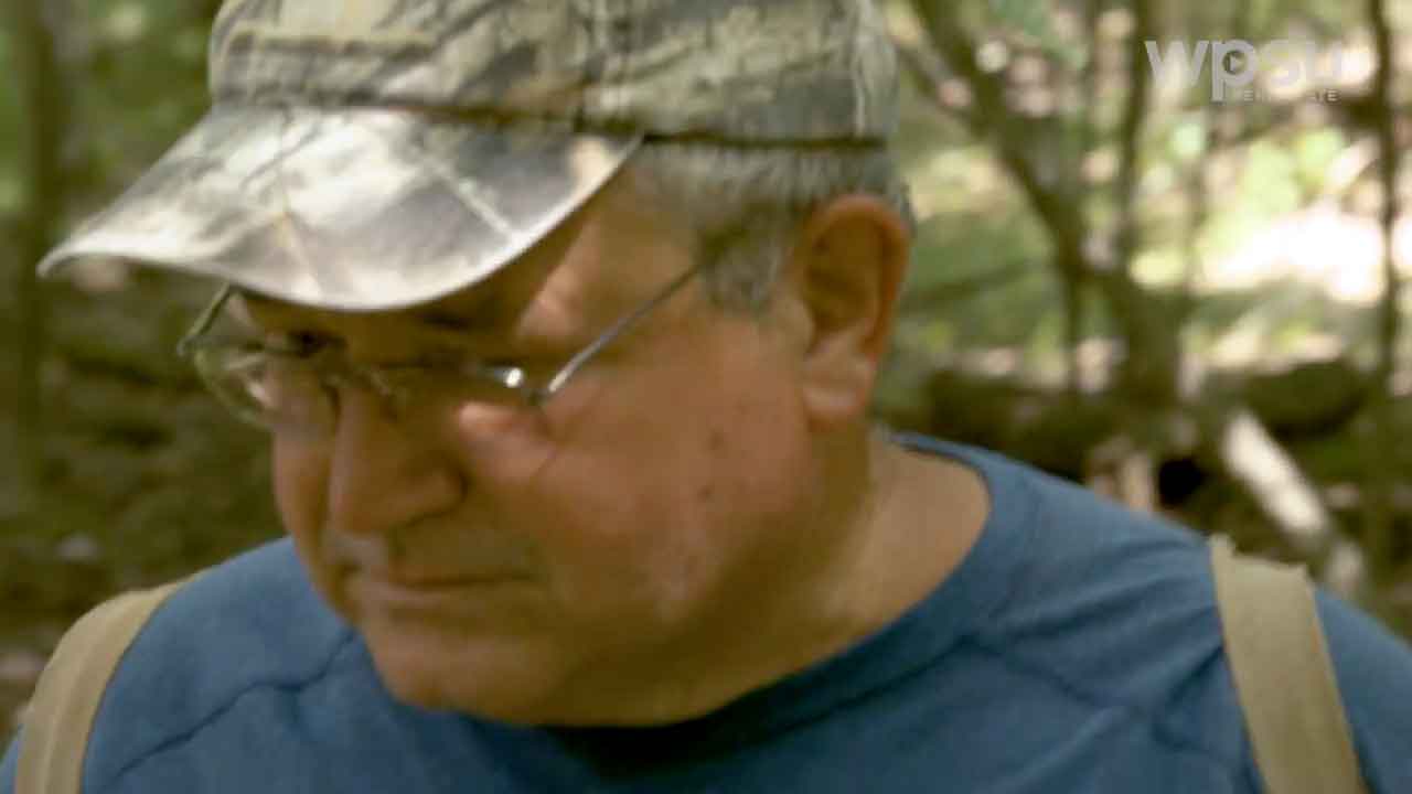 man looking down at the ground