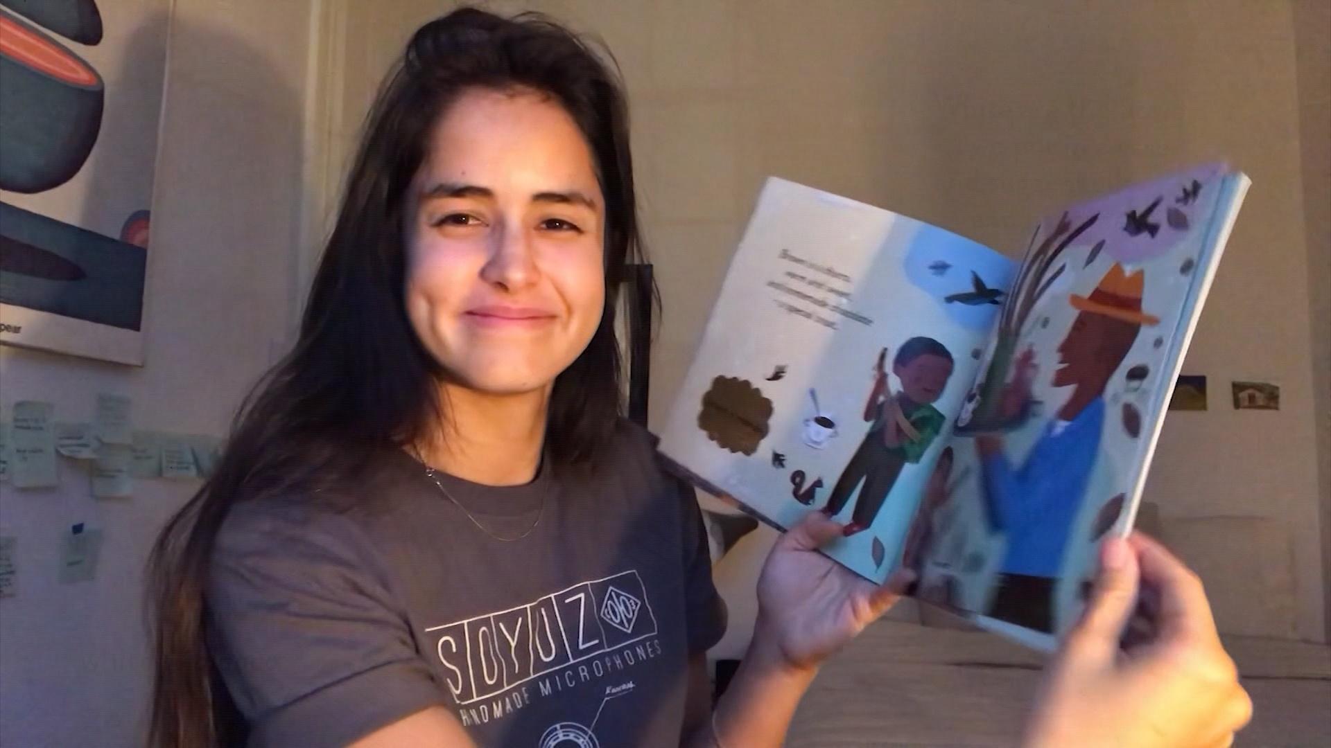 Woman reading a children's book