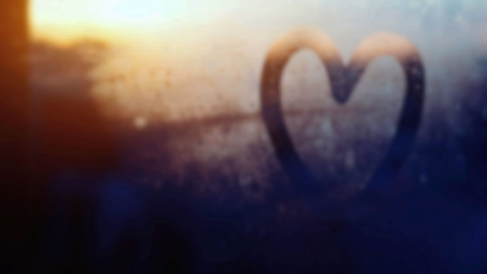 image of heart drawn on foggy glass