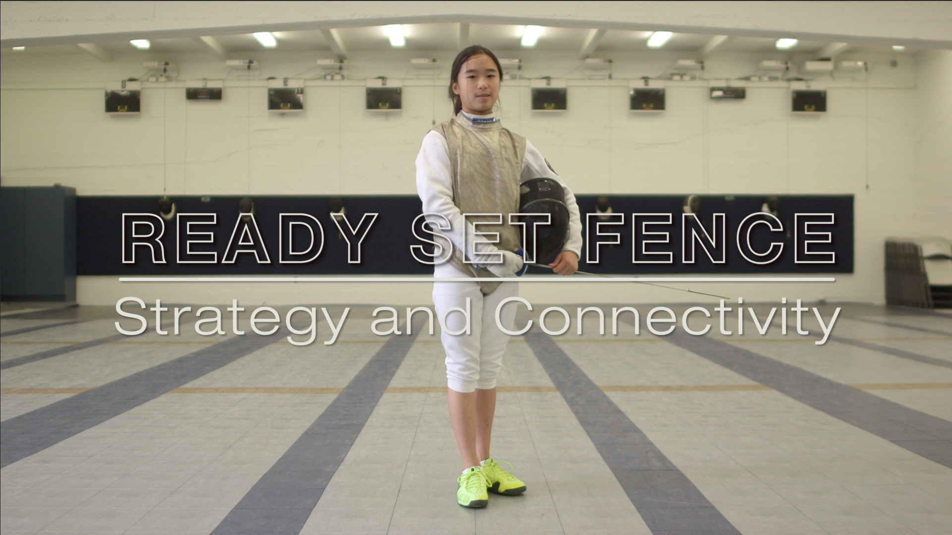 A woman in a fencing outfit