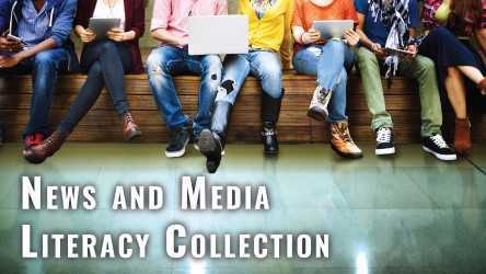 Several students sitting together working on devices