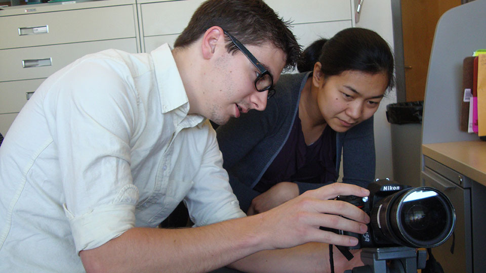intern working with camera