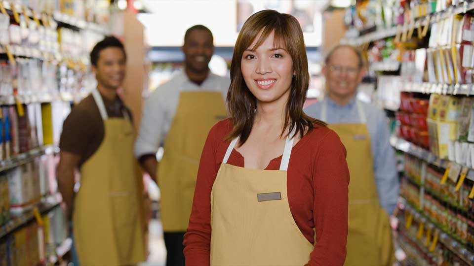 workers in grocery store aisle