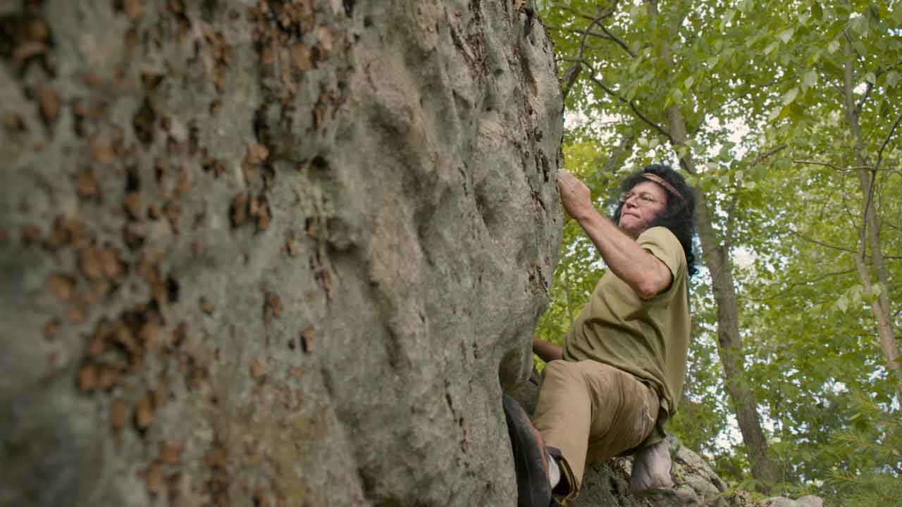 man rock climbing
