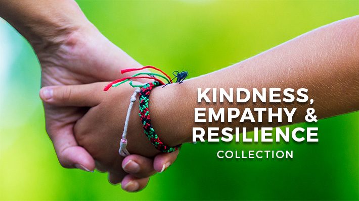 Two hands holding in front of a green background.