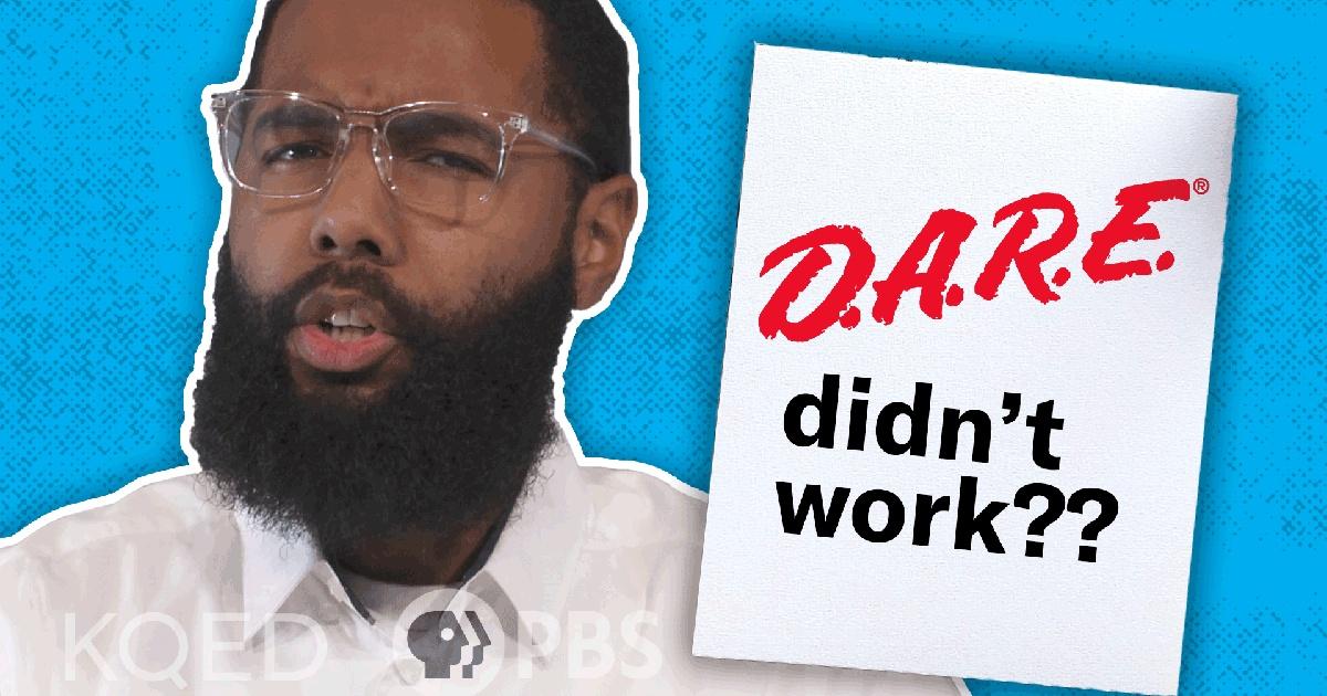 A man in front of a blue background.