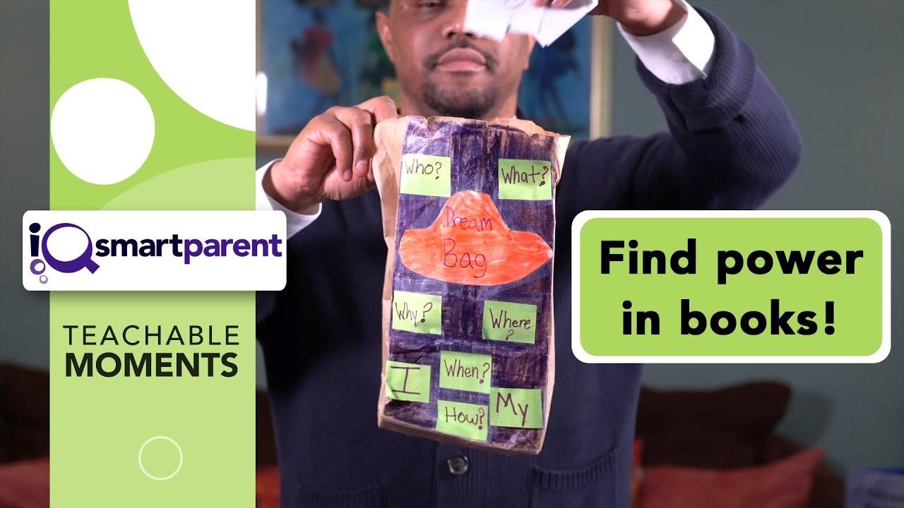 A Black man holds a paper bag and pulls paper out of it.