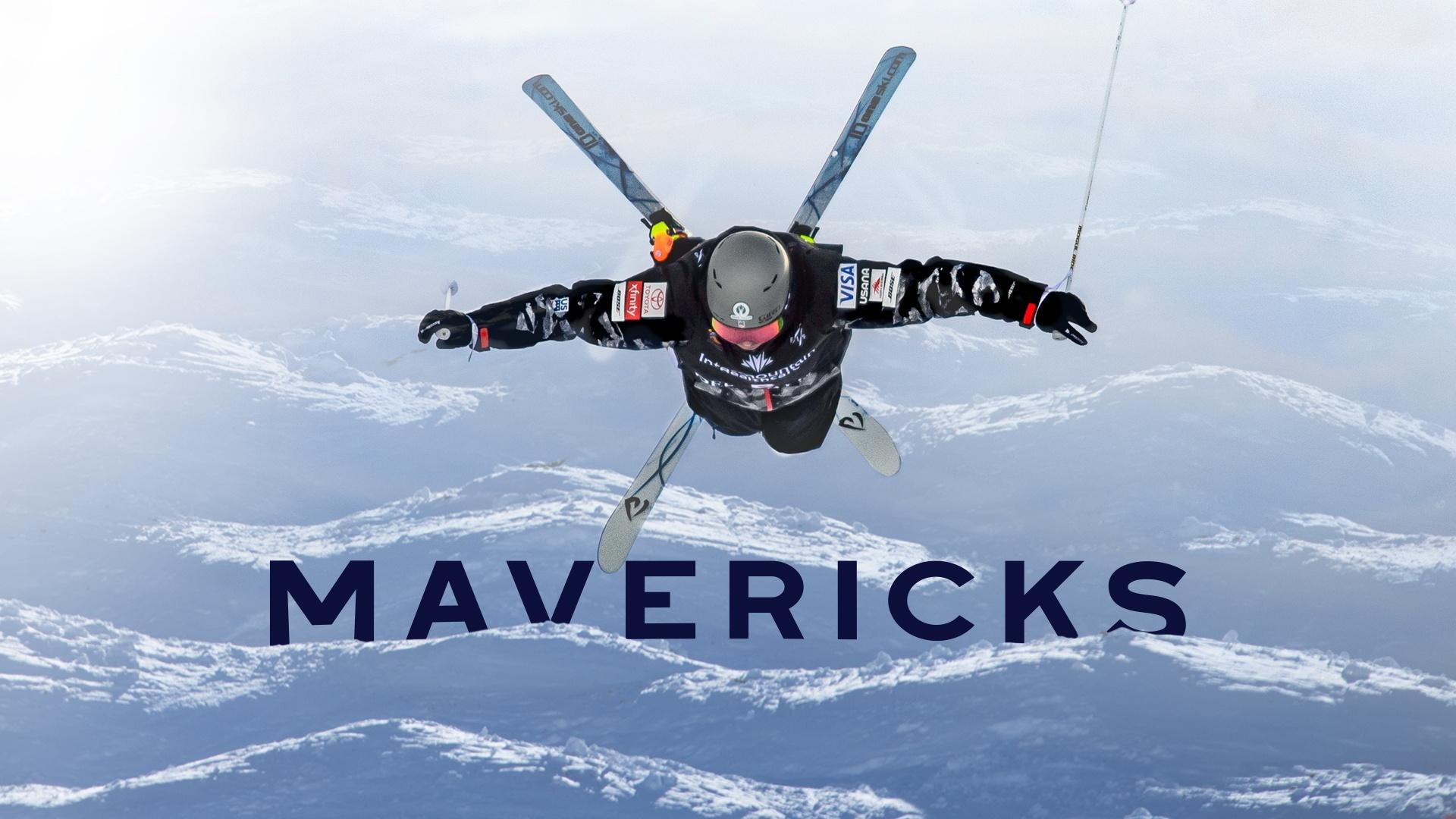 A person in skiing gear during a jump over ski hills.