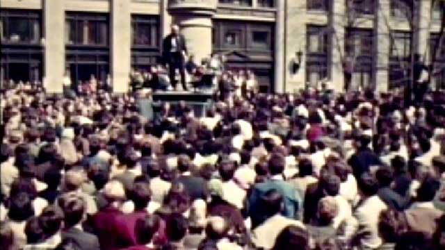 Archive photo of large crowd of people outside a government building.