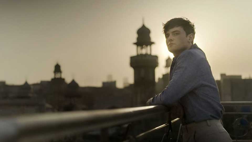 Tom Daley looking over a bridge.