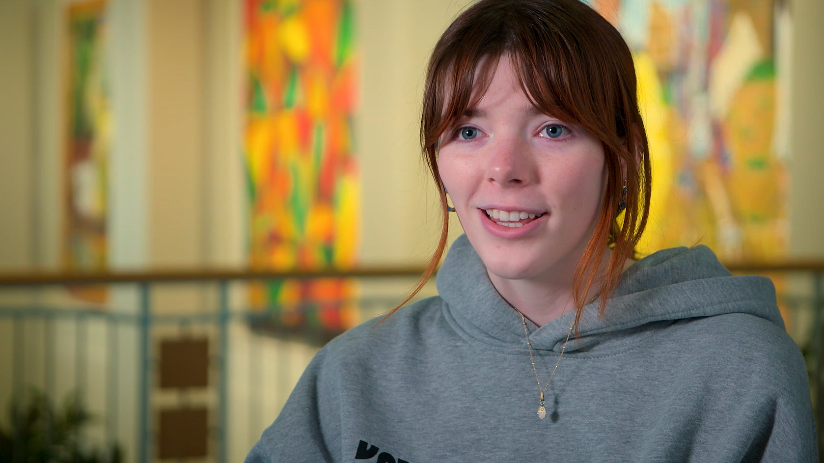 A student market stand worker speaking in an interview.