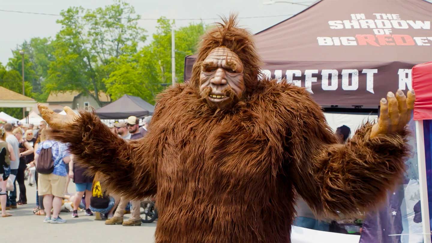 Person in Bigfoot costume shrugging.