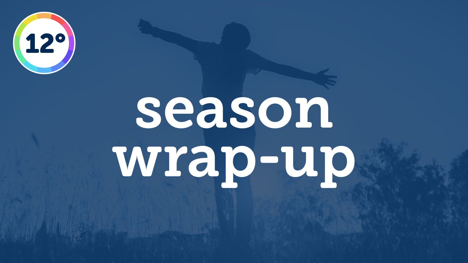 Person standing outdoors while arching back and stretching out arms.