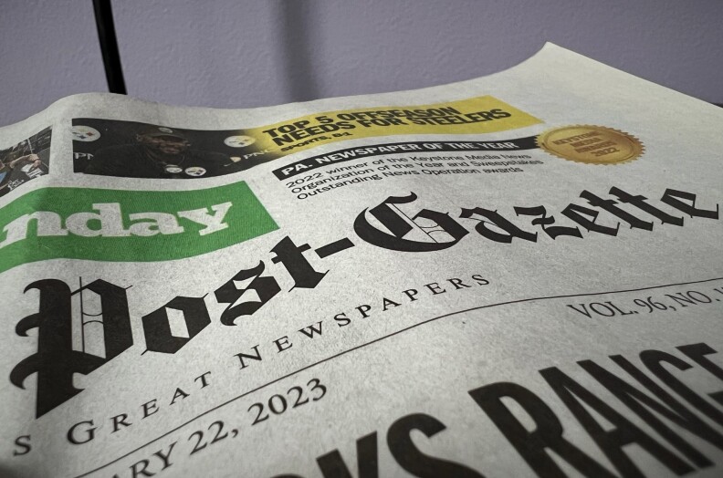 Close up of the headline of a newspaper.