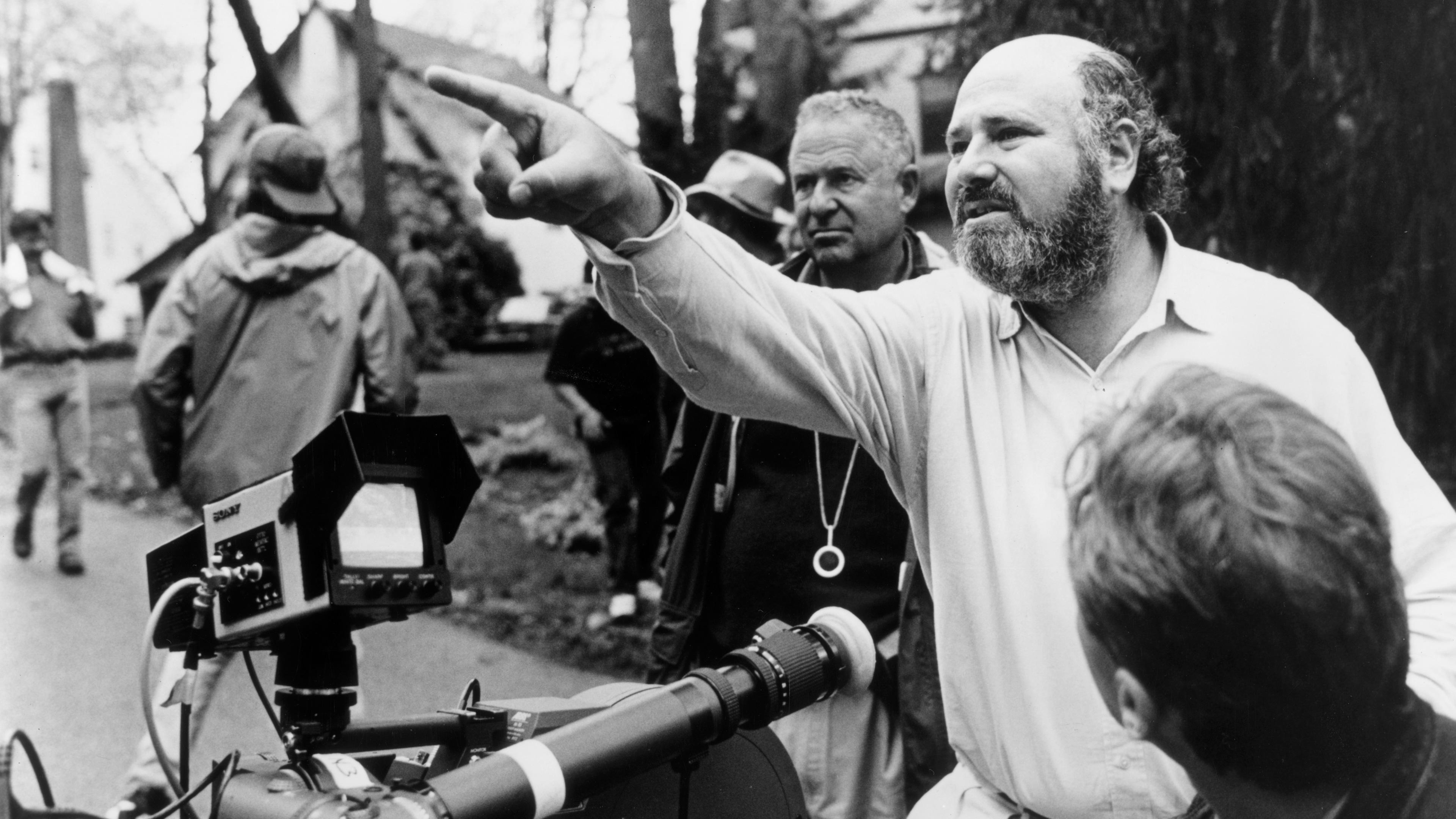 Rob Reiner giving direction behind camera.